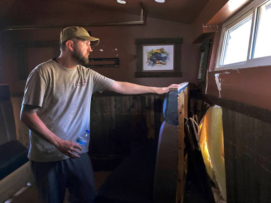 Brandon Gallegos, whose family owns the Oak Glen Steakhouse and Saloon, looks out while checkin ...