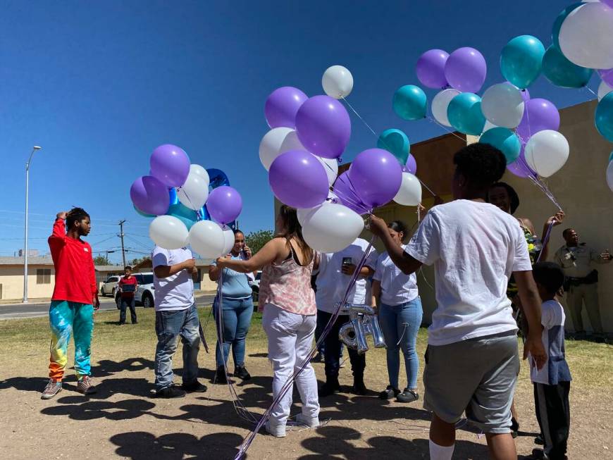 Family of Makayla Adams and community members prepare to release balloons into the sky outside ...