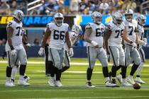 Raiders offensive line sets up, from left, Thayer Munford Jr. (77), Dylan Parham (66), Andre Ja ...