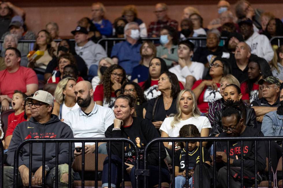 A group of Las Vegas Aces fans expresses disappointment during the final minutes in Game 3 of a ...