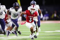 Liberty's Isaiah Lauofo (3) runs the ball in the first half of a football game against Kamehame ...
