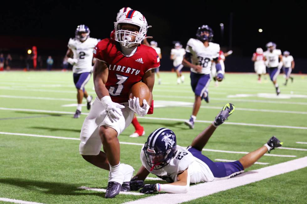 Kamehameha Kapalama's Kuhina Lunn (23) tackles Liberty's Isaiah Lauofo (3) in the second half o ...