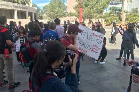UNLV students gather in a free speech zone on campus to march to protest gun violence, Wednesda ...