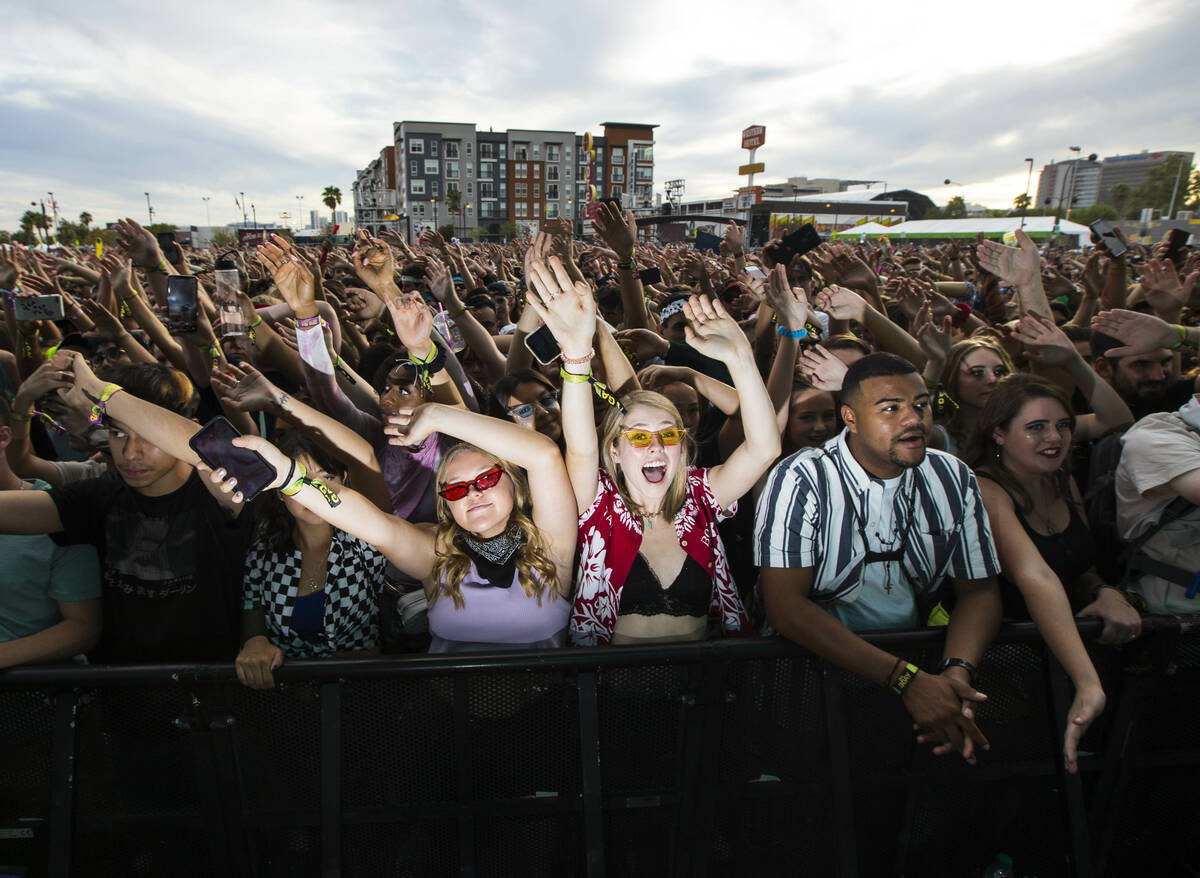 Attendees cheer as Oliver Tree, not pictured, performs at the Bacardi stage during day 3 of the ...