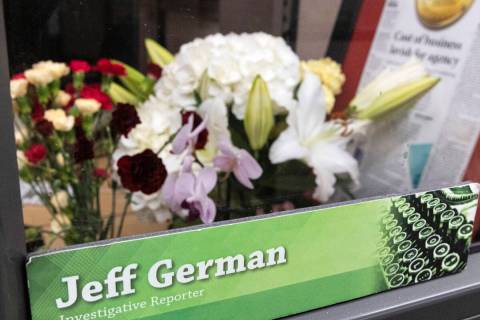 Flowers are placed on the desk of Jeff German, a Review-Journal investigative reporter, on Tues ...