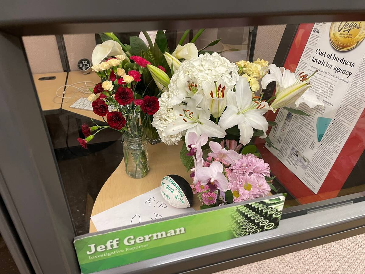 Flower, notes, and a small football appeared on Jeff German's desk in the Review-Journal newsro ...