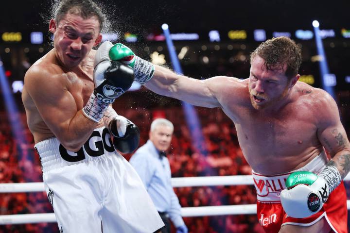 Saul "Canelo" Alvarez, right, connects a punch against Gennadiy "GGG" Golov ...