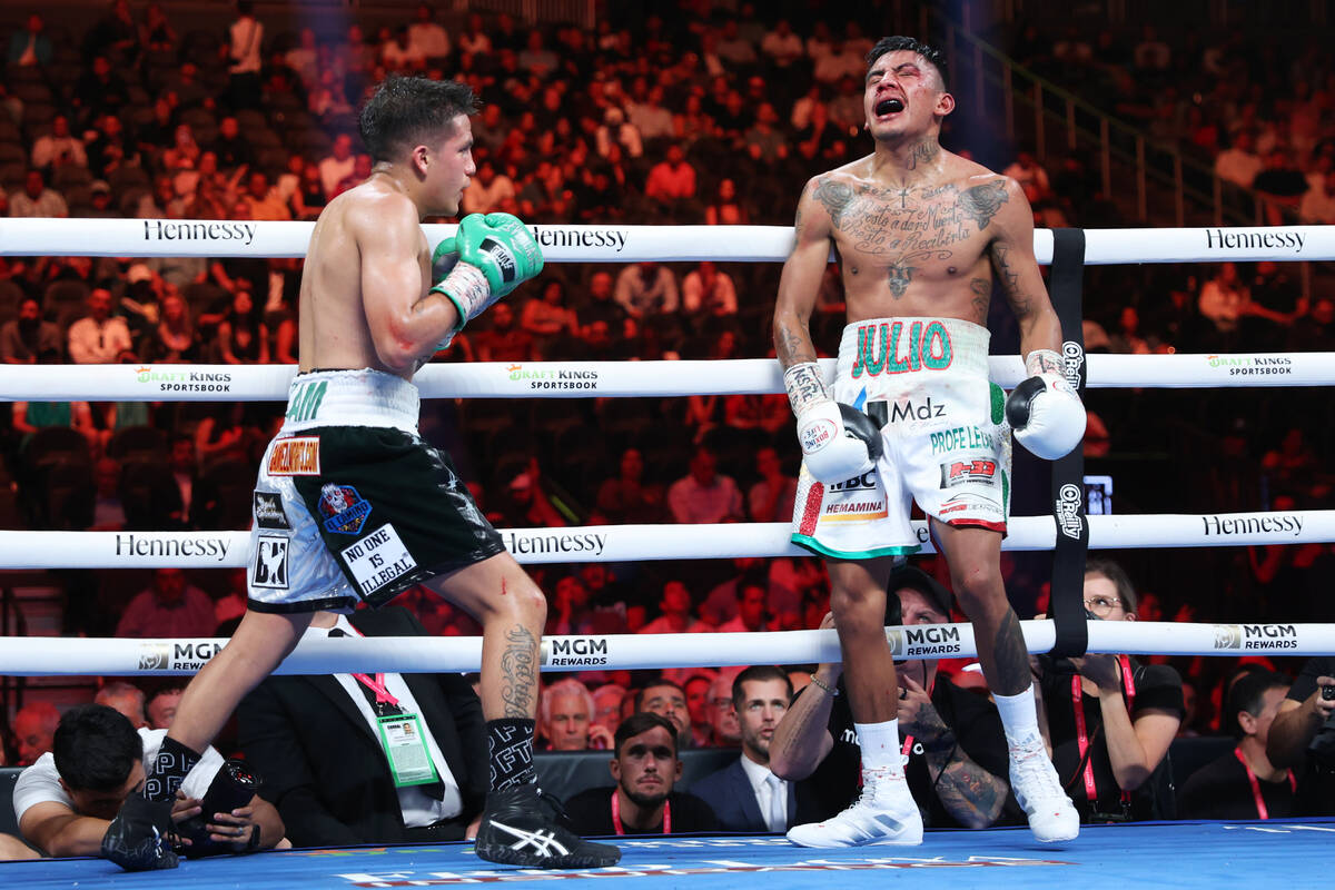 Jesse "Bam" Rodriguez, left, hits Israel Gonzalez with a low blow in the eight round of a flywe ...