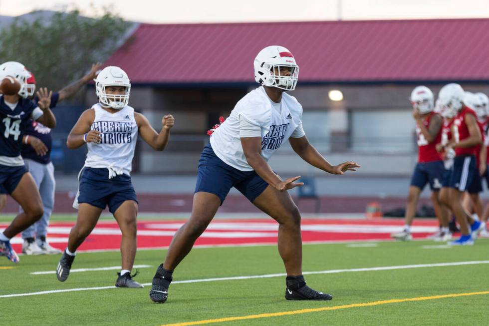 Ed Haynes runs a drill during a team football practice at Liberty High School in Henderson, Mon ...