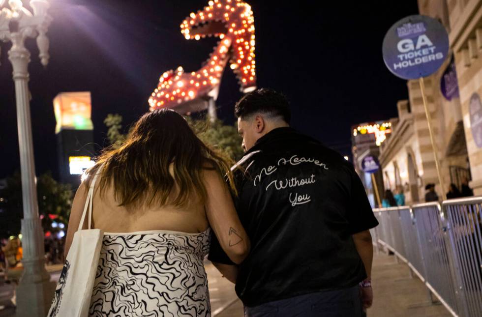 Attendees walk the festival grounds during the Life is Beautiful festival on Saturday, Sept. 17 ...