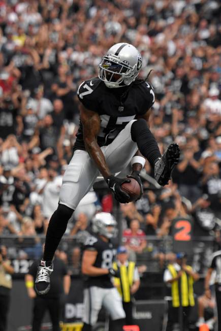 Las Vegas Raiders wide receiver Davante Adams (17) celebrates after a touchdown reception durin ...