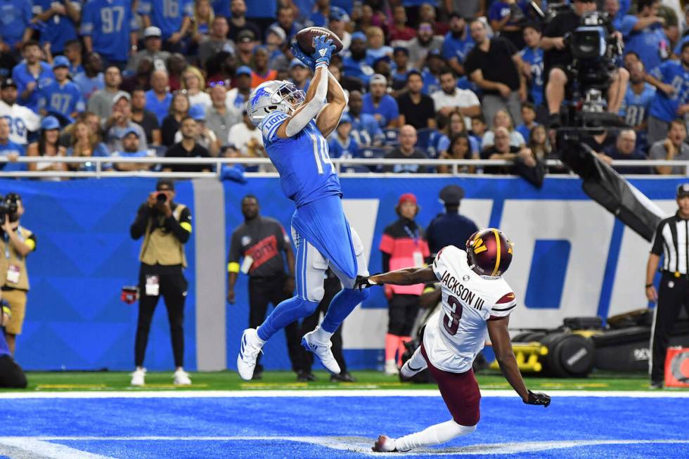 Detroit Lions wide receiver Amon-Ra St. Brown (14) makes a touchdown catch against Washington C ...