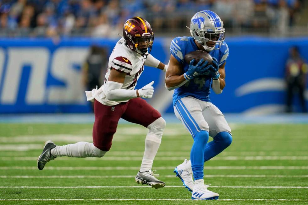 Detroit Lions wide receiver Amon-Ra St. Brown (14) makes a catch against Washington Commanders ...