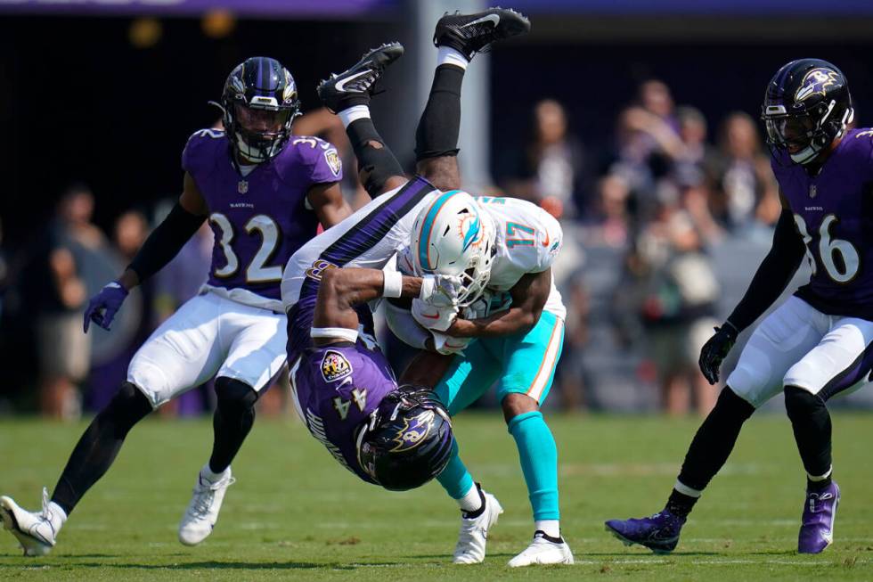 Baltimore Ravens cornerback Marlon Humphrey attempts to stop Miami Dolphins wide receiver Jayle ...