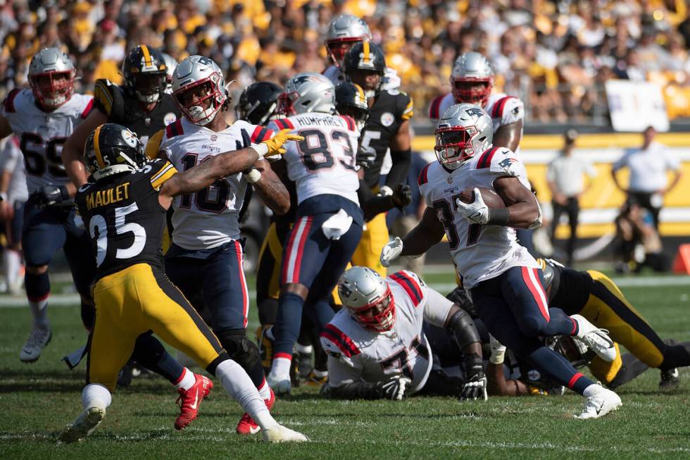 New England Patriots running back Damien Harris (37) carries the ball in the fourth quarter dur ...