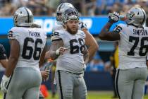 Raiders center Andre James (68) looks on during a timeout with offensive lineman Dylan Parham ( ...