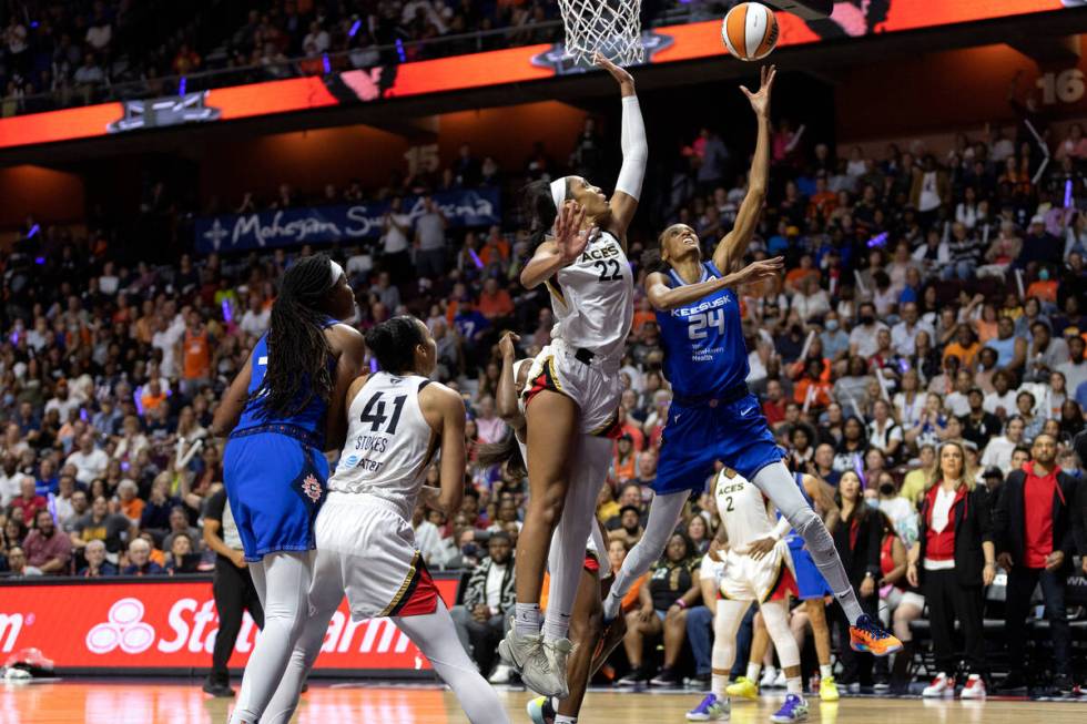 Connecticut Sun forward DeWanna Bonner (24) shoots against Las Vegas Aces forward A'ja Wilson ( ...