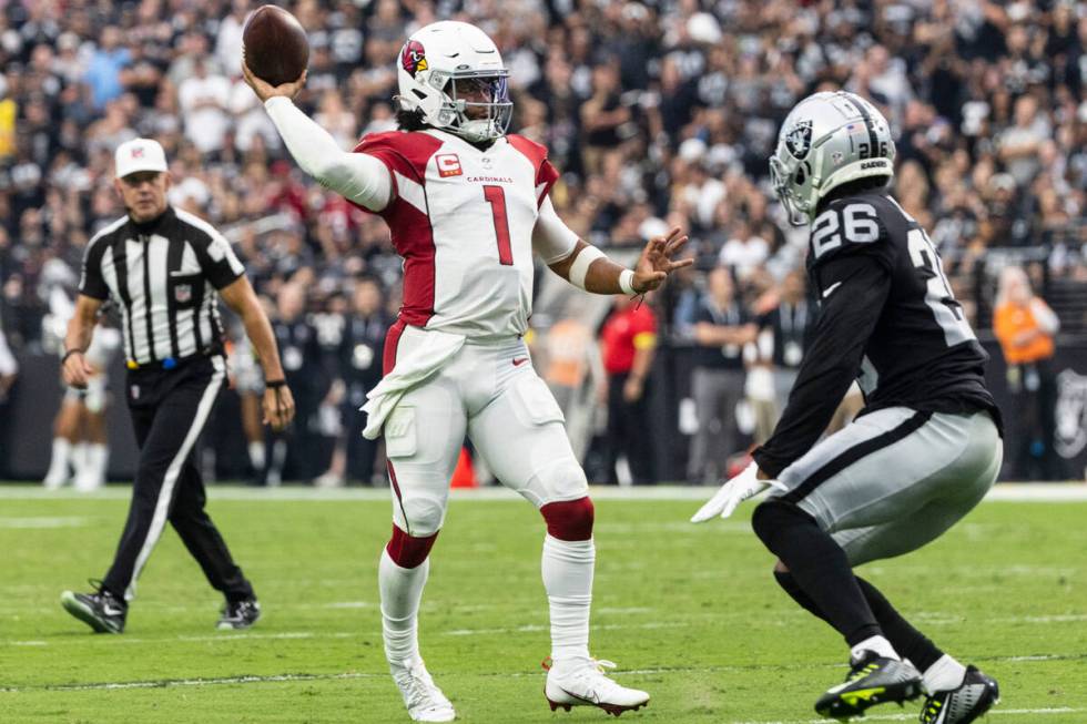 Arizona Cardinals quarterback Kyler Murray (1) throws the ball as Las Vegas Raiders cornerback ...