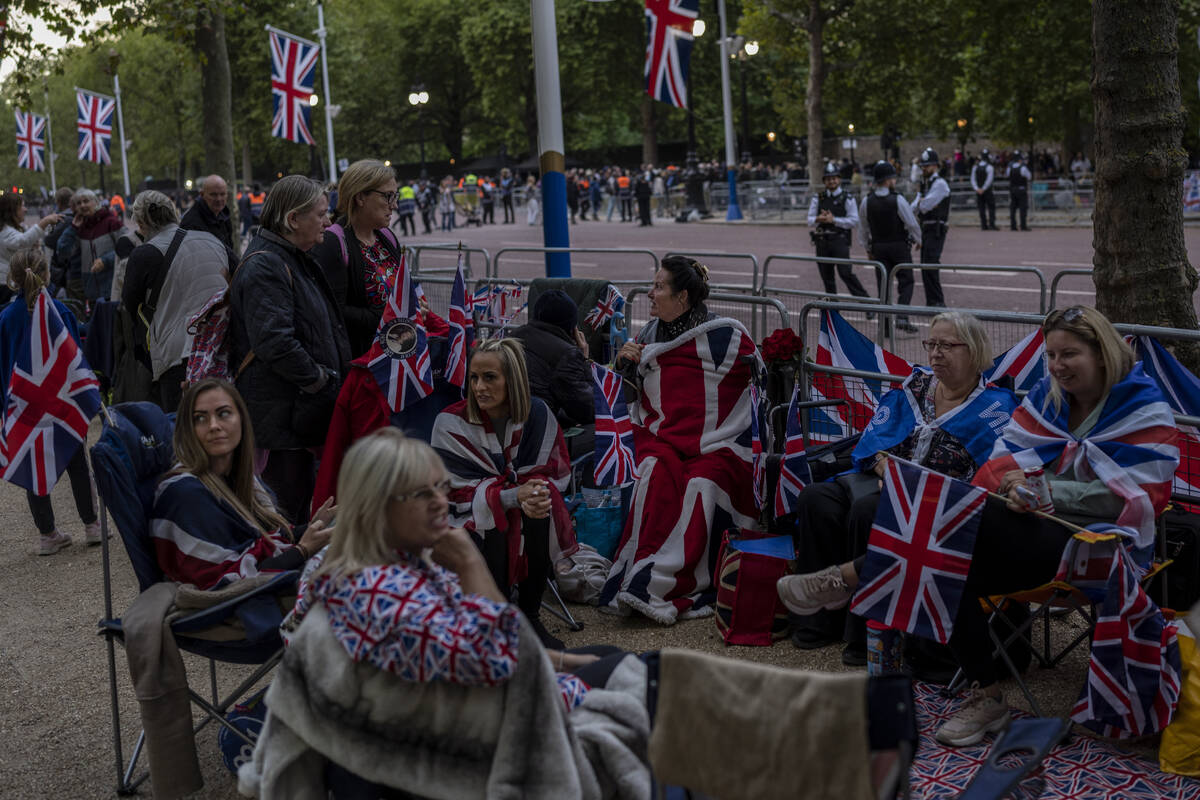 People camp out on The Mall on the eve of the funeral of Queen Elizabeth II in London, England, ...