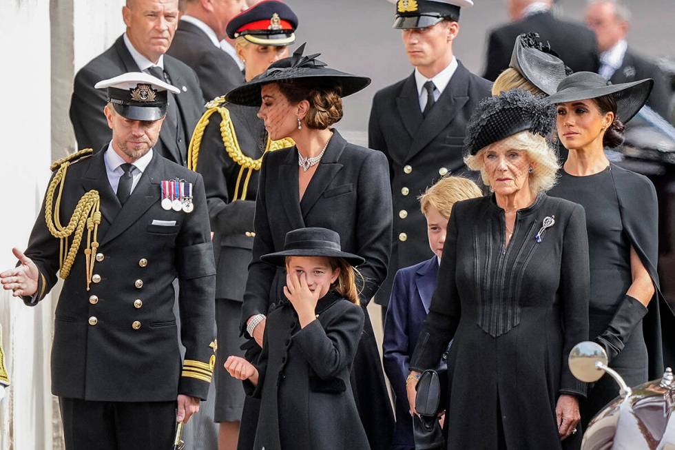 Kate, Princess of Wales, from left, Princess Charlotte, Prince George, Camilla, the Queen Conso ...