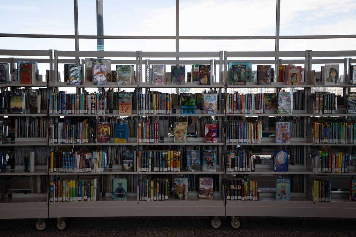 Henderson Libraries celebrate the grand opening of a new library branch with a ribbon cutting a ...