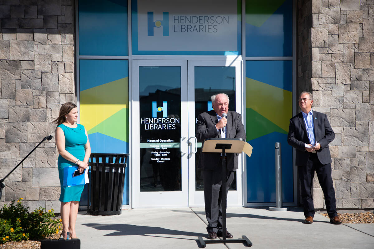 Councilman Dan Shaw, center, speaks at the debut of the new West Henderson Library branch on Tu ...