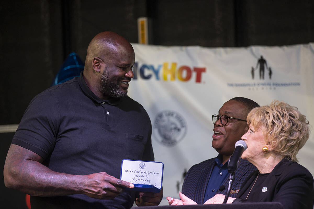 Shaquille O’Neal, left, is presented with the key of the city from Las Vegas Mayor Carol ...