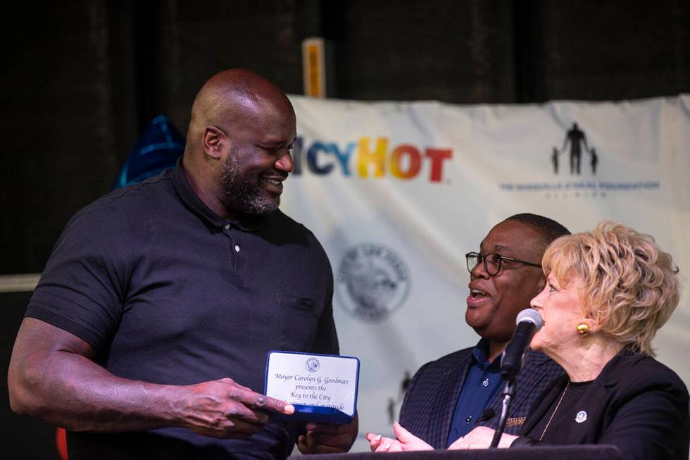 Shaquille O’Neal, left, is presented with the key of the city from Las Vegas Mayor Carol ...