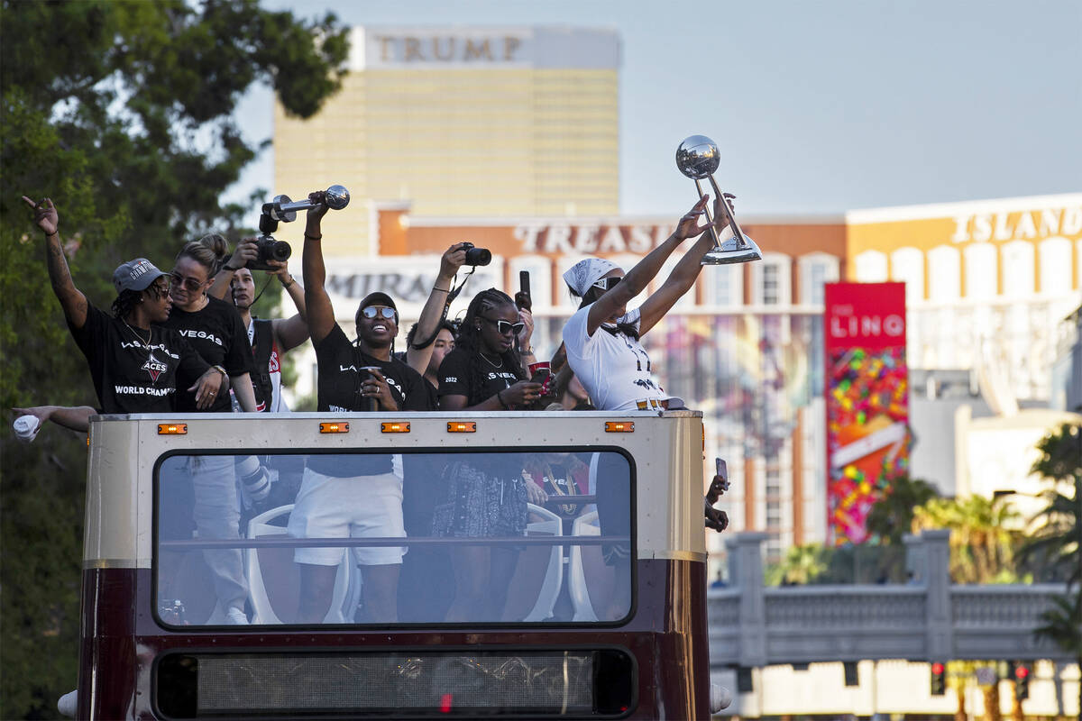 The Las Vegas Aces ride a double-decker bus down the Las Vegas Strip during a parade to celebra ...