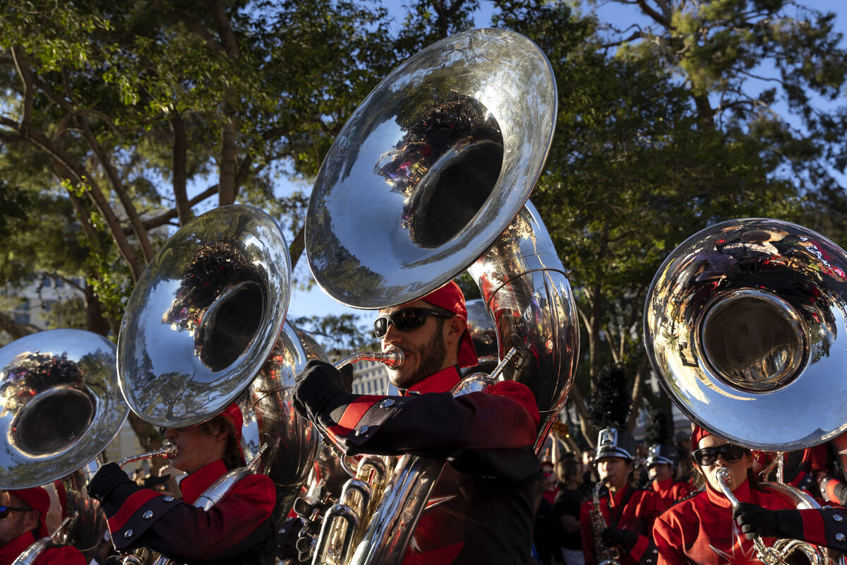 The UNLV marching band proceeds down Las Vegas Boulevard during a parade in honor of the Las Ve ...