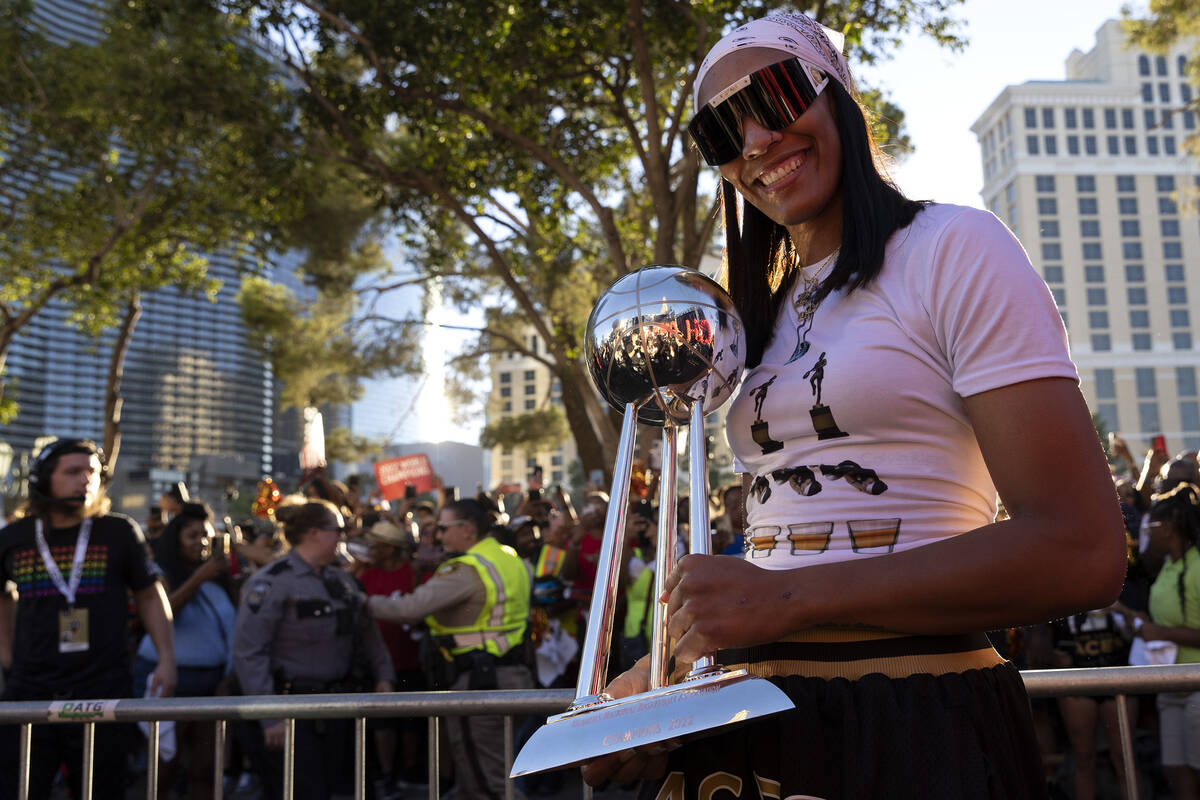 Las Vegas Aces forward A'ja Wilson, also the 2022 WNBA MVP, holds up the WNBA Championship trop ...