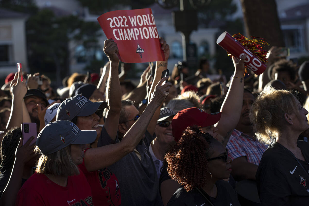Las Vegas Aces fans cheer for their team during a parade to honor their 2022 WNBA Championship ...