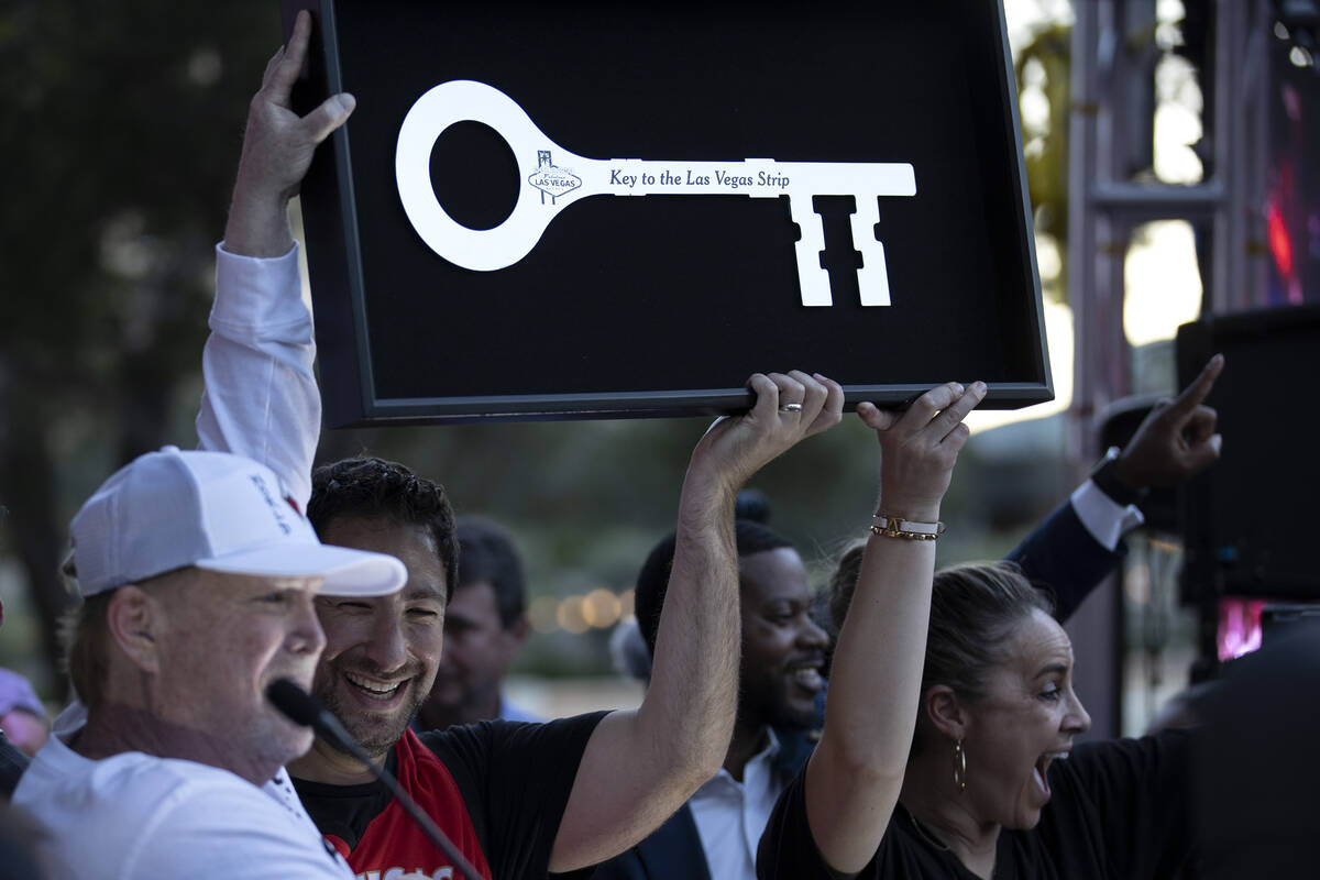 Las Vegas Aces owner Mark Davis and head coach Becky Hammon are presented with a key to the Las ...