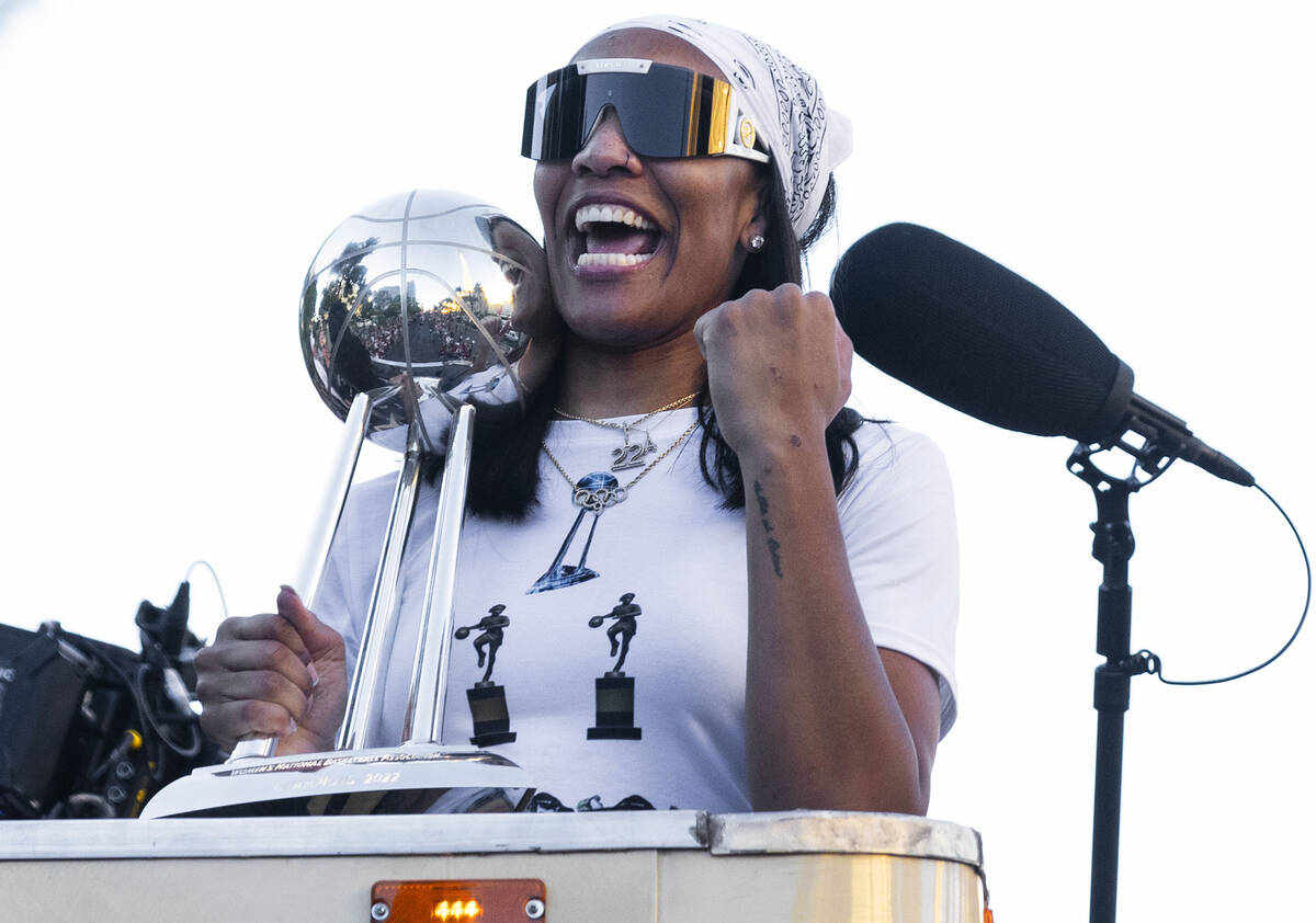 Las Vegas Aces' A'ja Wilson holds up the championship trophy during the team's WNBA Championshi ...