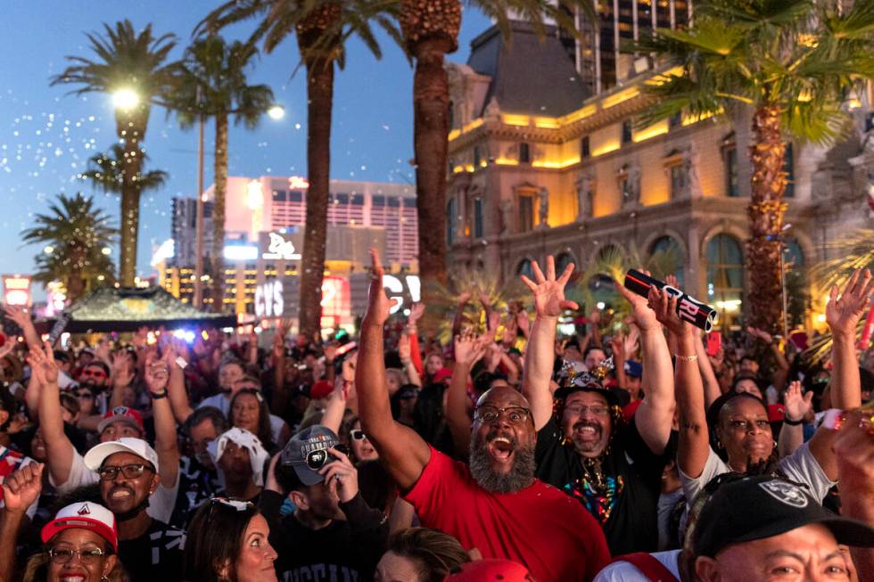 Las Vegas Aces fans cheer for their team during a parade to celebrate the Aces’ 2022 WNB ...