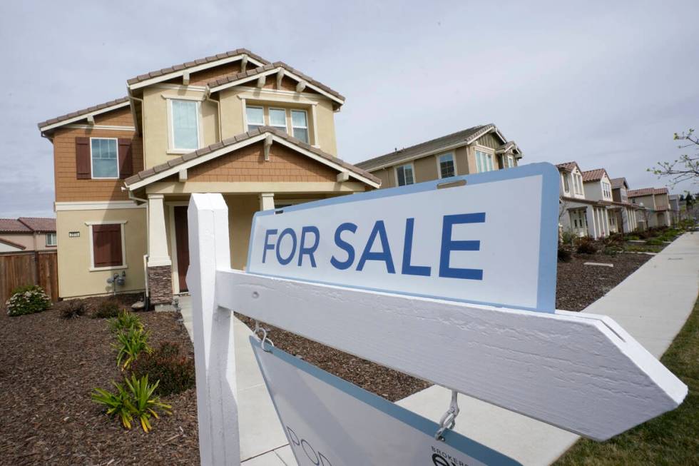 A for sale sign is posted in front of a home in Sacramento, Calif., Thursday, March 3, 2022. Th ...