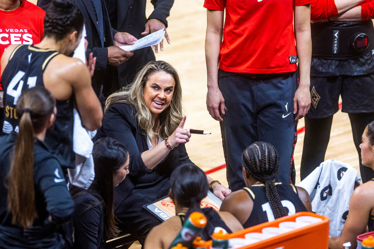 Las Vegas Aces head coach Becky Hammon counsels her players in a timeout versus the Seattle Sto ...