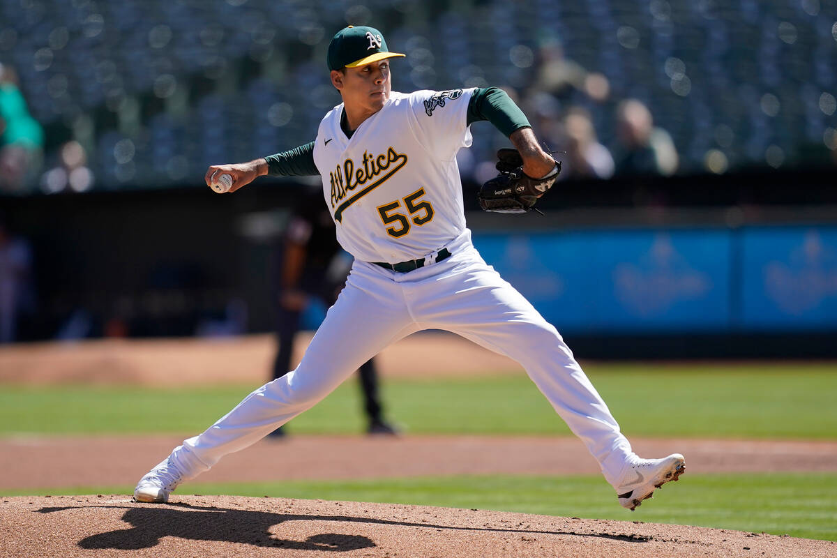 Oakland Athletics' Adrian Martinez pitches against the Seattle Mariners during the first inning ...