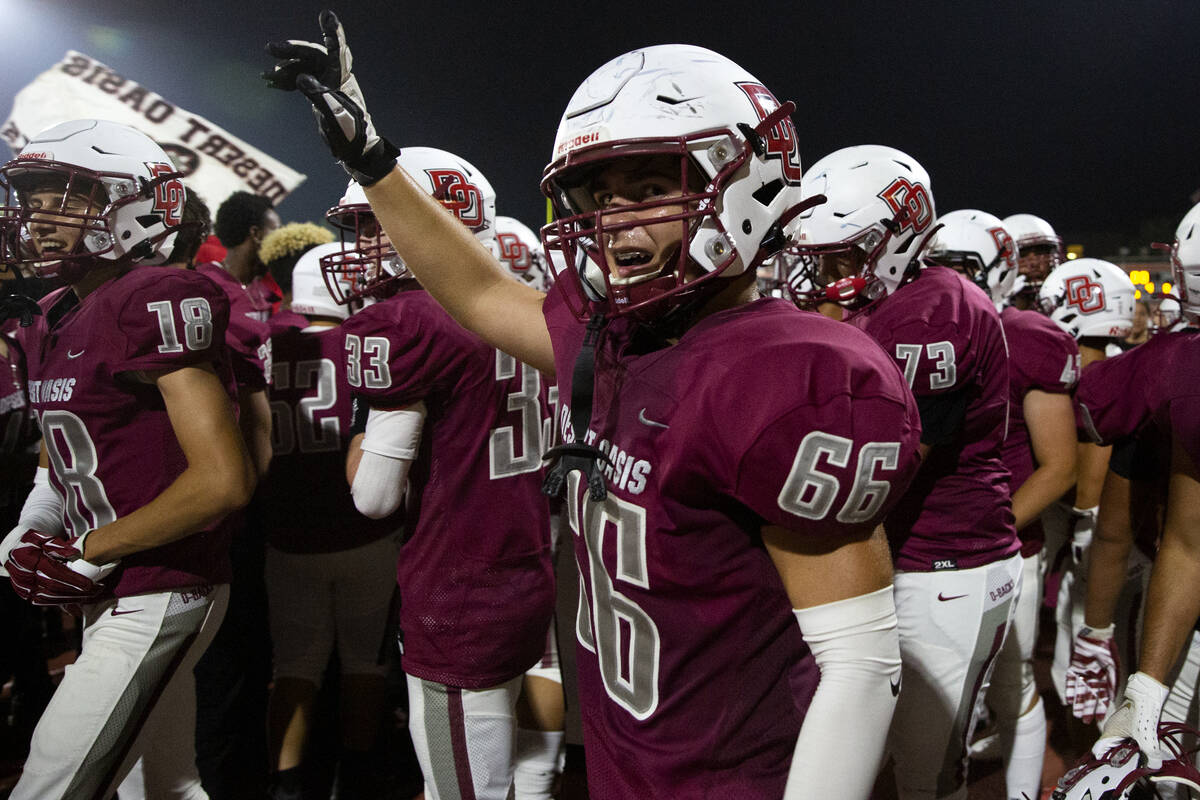 Desert Oasis celebrates a win against Spring Valley, including linebacker Tristan Pope (66) dur ...
