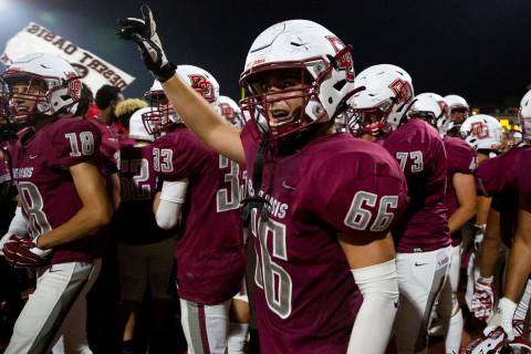 Desert Oasis celebrates a win against Spring Valley, including linebacker Tristan Pope (66) dur ...
