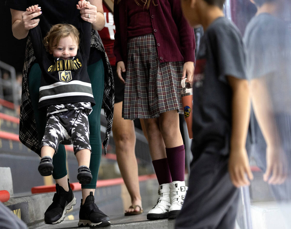 Wolf Dyal, 1, left, attends his first Vegas Golden Knights event during training camp practice ...