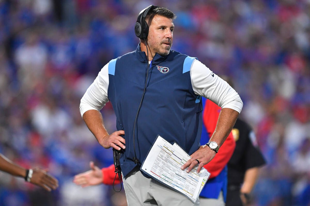 Tennessee Titans head coach Mike Vrabel stands on the field during the first half an NFL footba ...