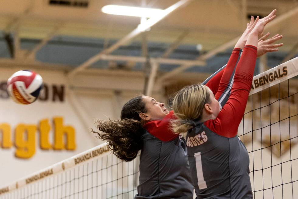 Arbor View’s Willow Watson, left, and Sarah Hoofman (1) miss a kill during a high school ...