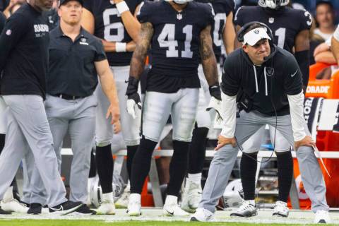 Raiders head coach Josh McDaniels watches the game from the sideline during the first half on a ...