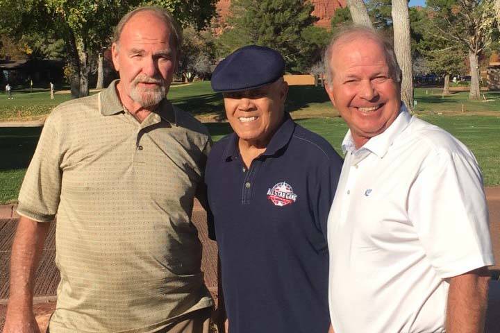 Former Los Angeles Dodgers base-stealing great Maury Wills, center, is flanked by Las Vegans Du ...