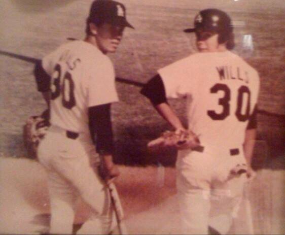 Former Los Angeles Dodgers base-stealing great Maury Wills, left, and Brady Exbur, right, are s ...