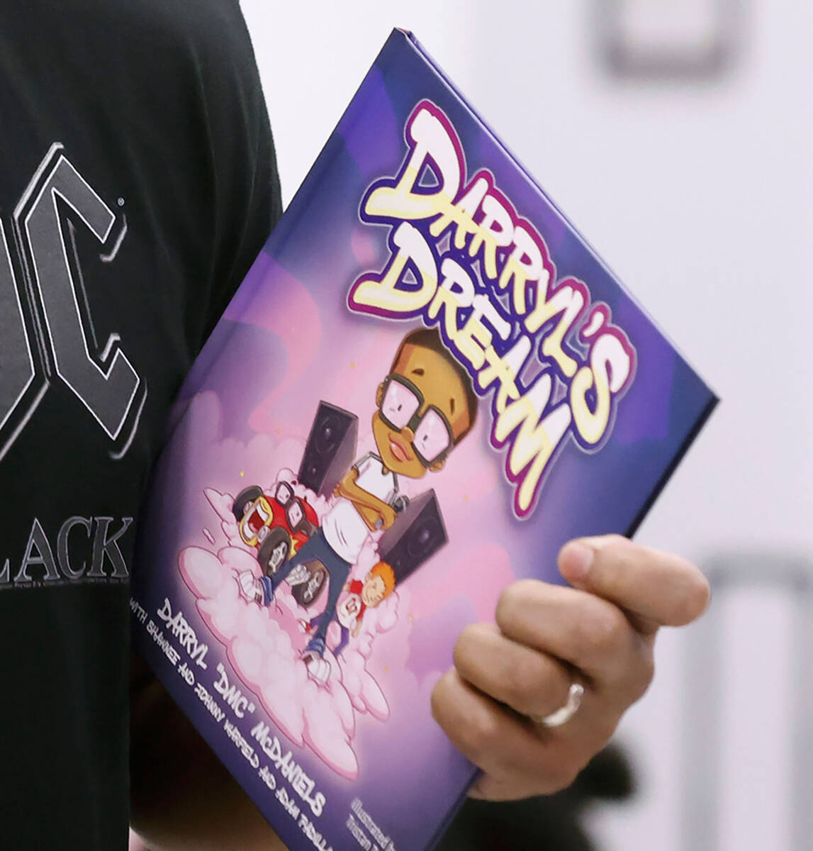 Grammy Award-winning rapper Darryl “DMC” McDaniels holds his new book, “Darryl’s Dream, ...
