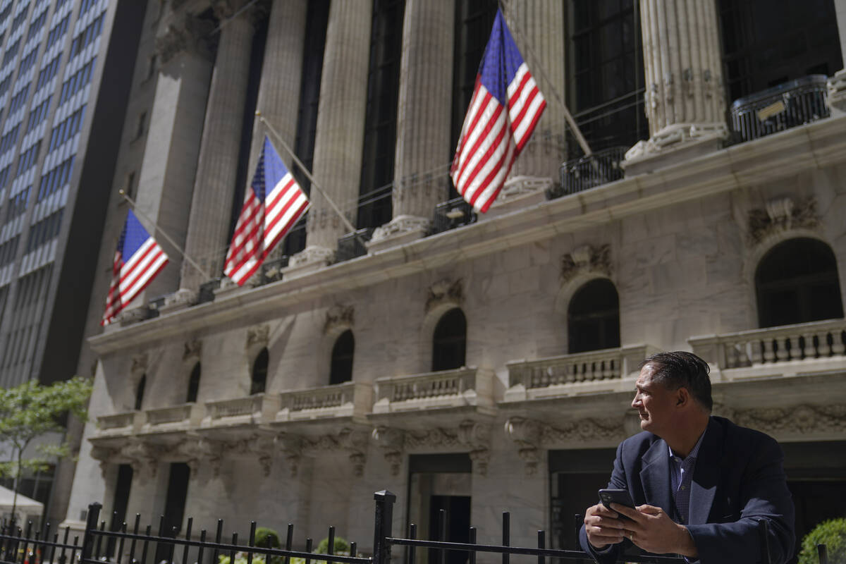 A trader stands outside the New York Stock Exchange, Friday, Sept. 23, 2022, in New York. Stock ...