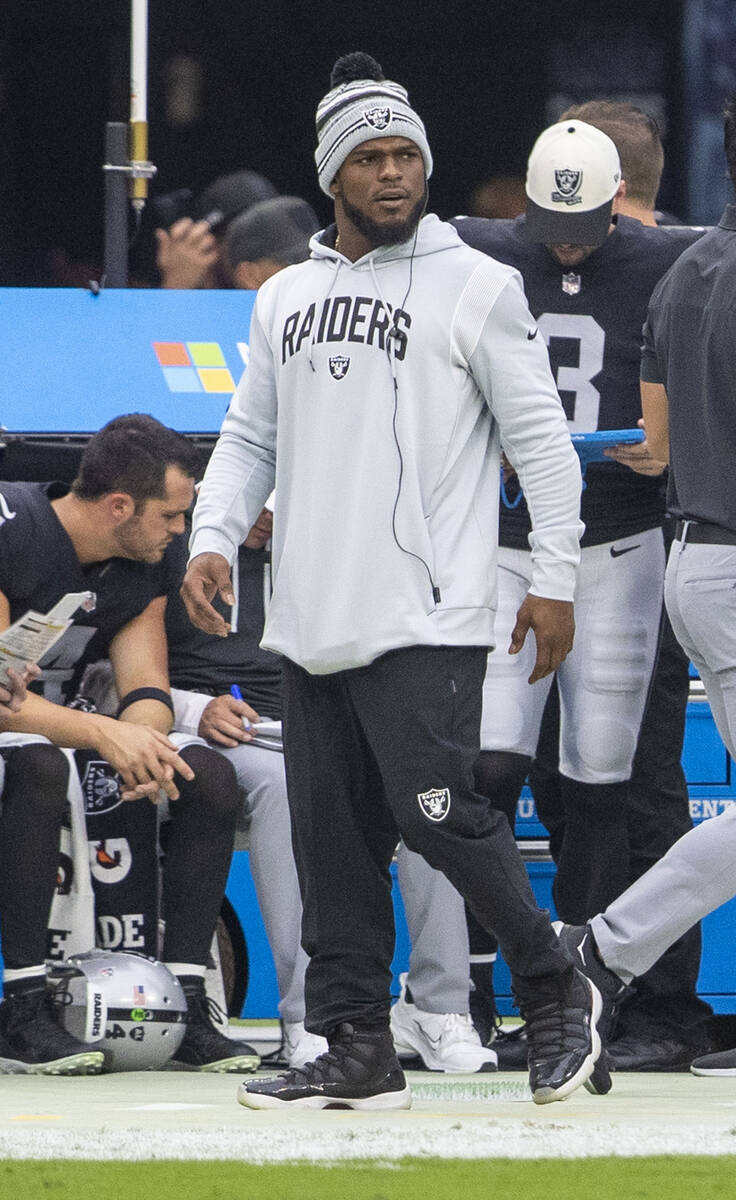 Raiders linebacker Denzel Perryman walks the sideline during the first half of an NFL game agai ...
