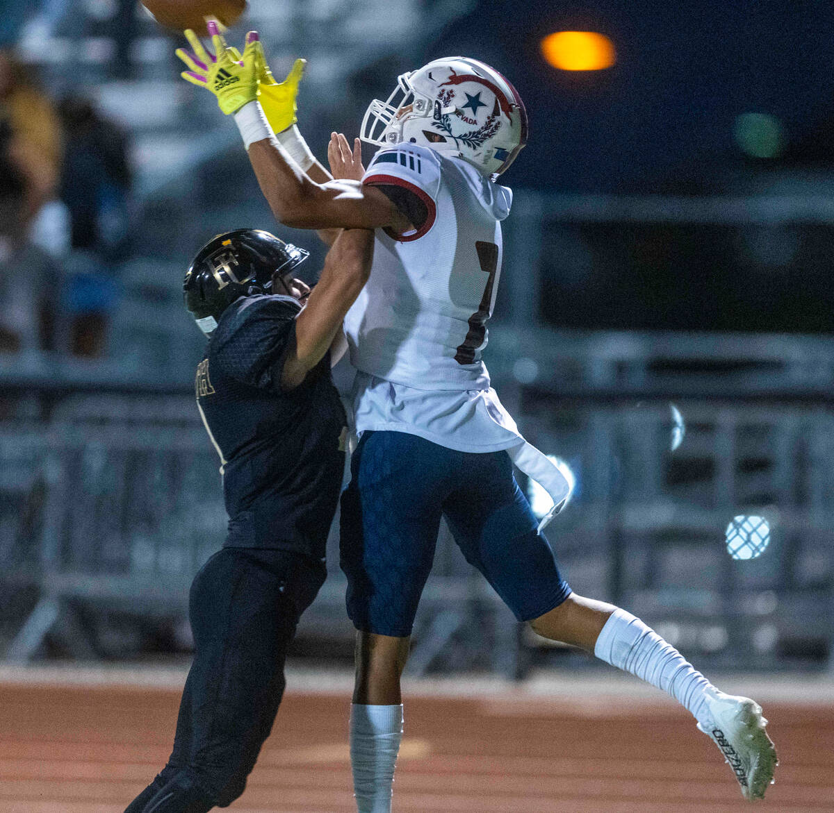 Liberty wide receiver Jayden Robertson (7) elevates for a touchdown reception over Faith Luther ...